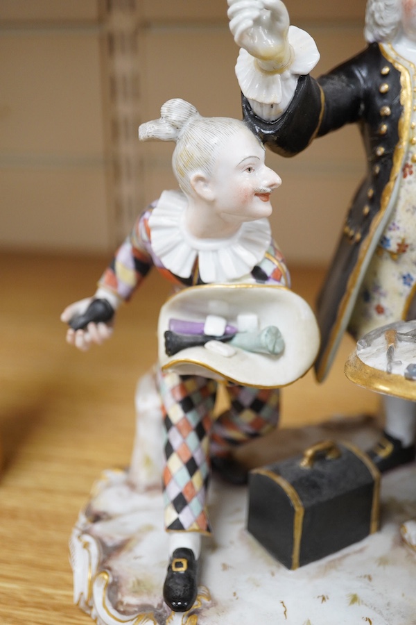 A 19th century Meissen group of The Dentist, outside decorated, incised model no. 186, 21cm. Condition - broken and restored